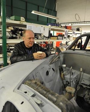 Ian Callum with his car at CMC's workshops